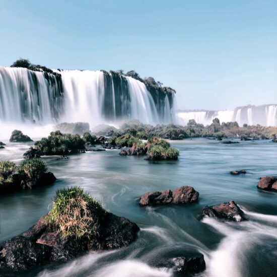 waterfalls under clear sky during daytime digital wallpaper